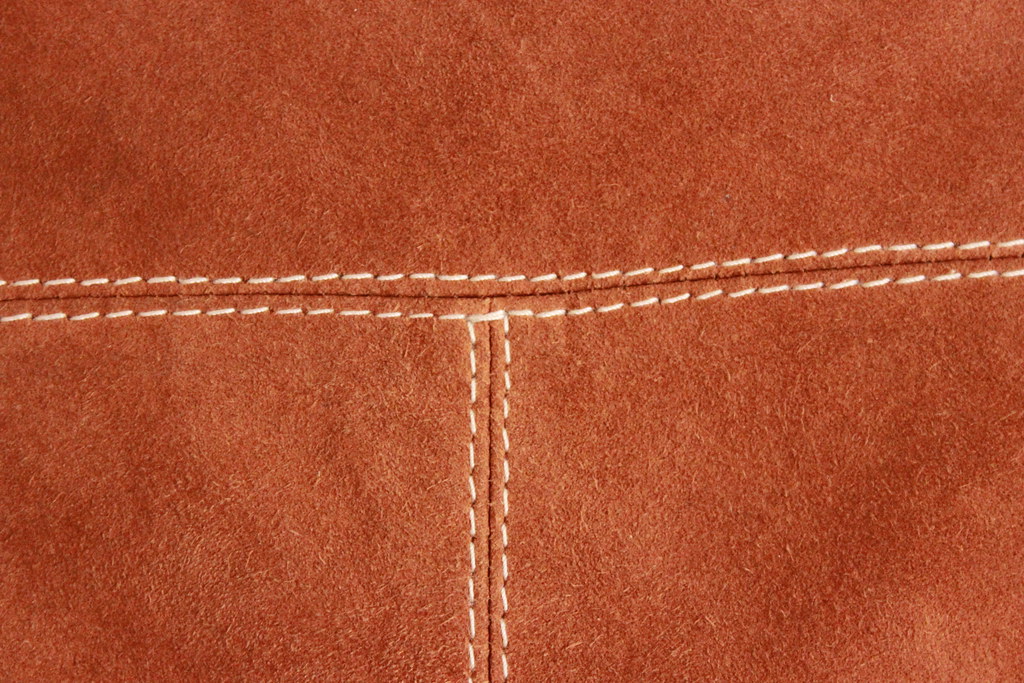 Close detail of stitched leather material
