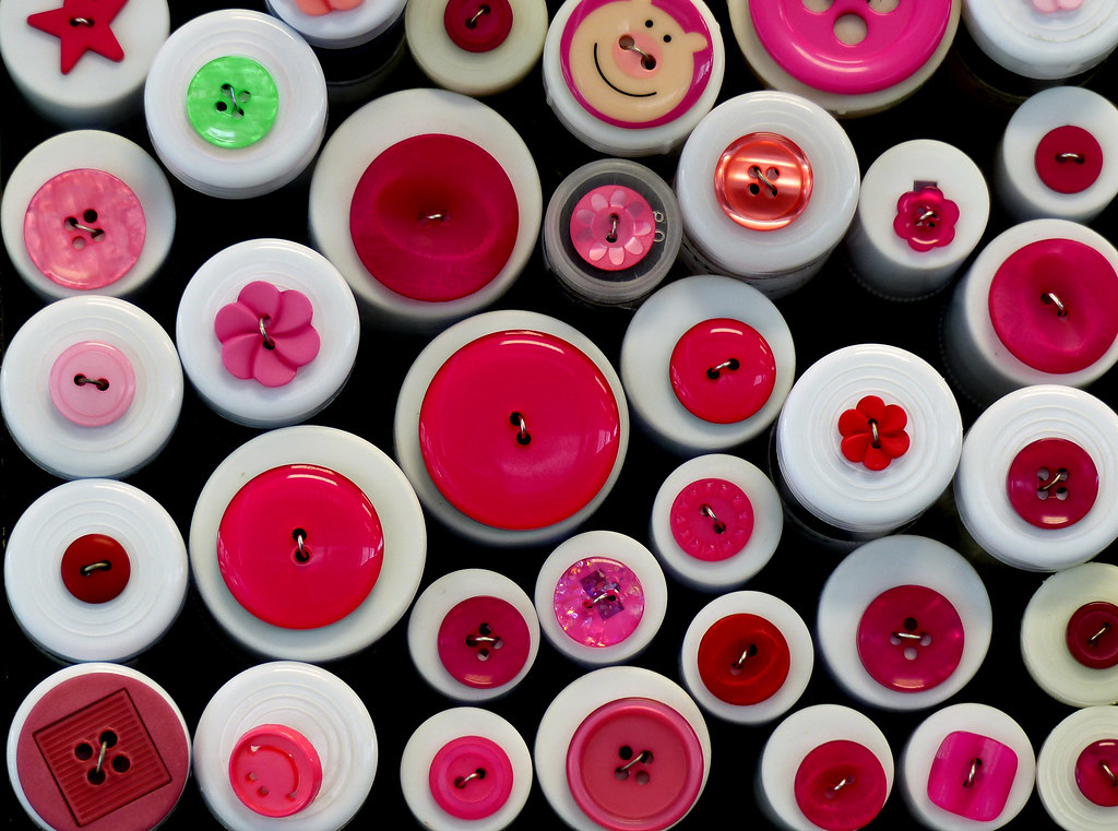 Colorful sewing buttons arranged for garment repair work