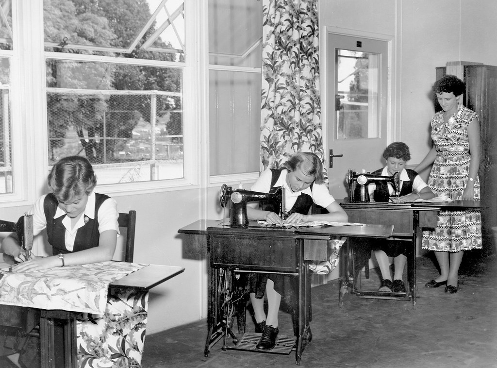 Sewing classroom with students working at machines
