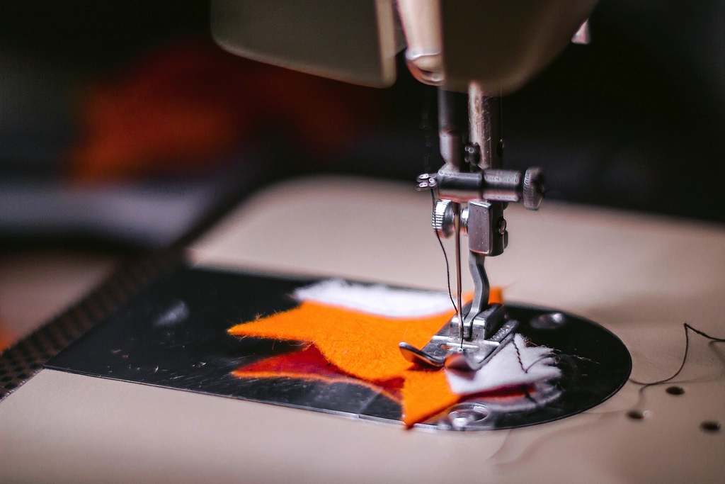 Close view of a sewing machine and fabric